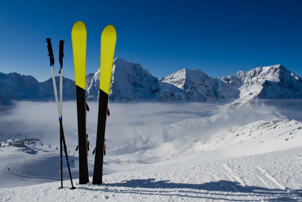 ski gear on top of snowy mountain range