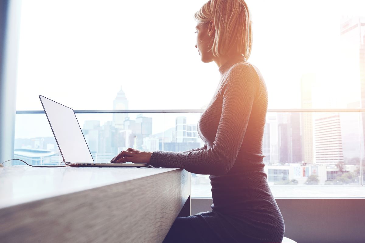 woman working remotely laptop